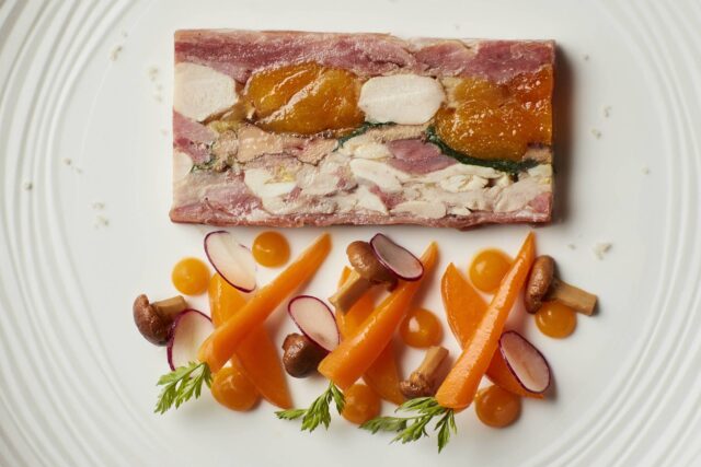 Large group party enjoying a premium tasting menu inside a Galvin private dining space.
