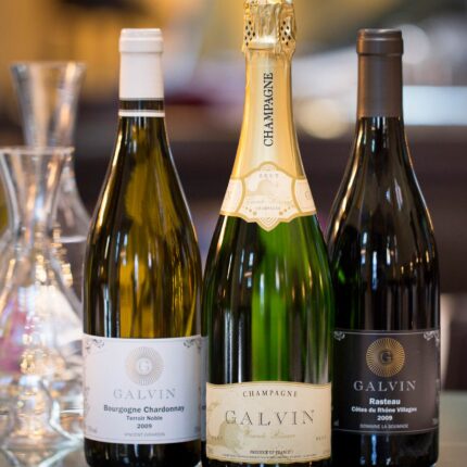 A meticulously curated selection of premium French wine and champagne bottles displayed elegantly.