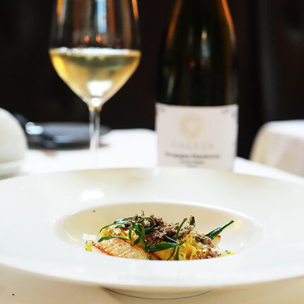 Finely shaved black truffle over a modern French culinary creation at Galvin La Chapelle