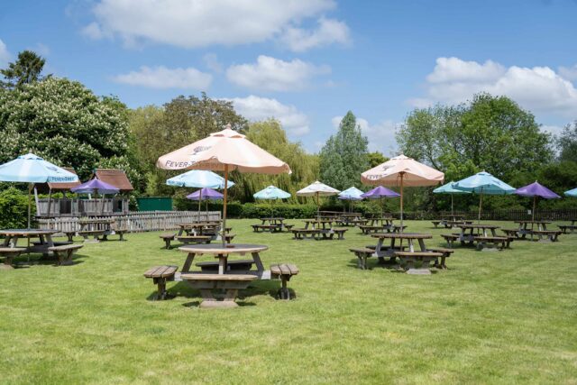 The spacious, beautifully landscaped beer garden at Galvin Green Man near Chelmsford.