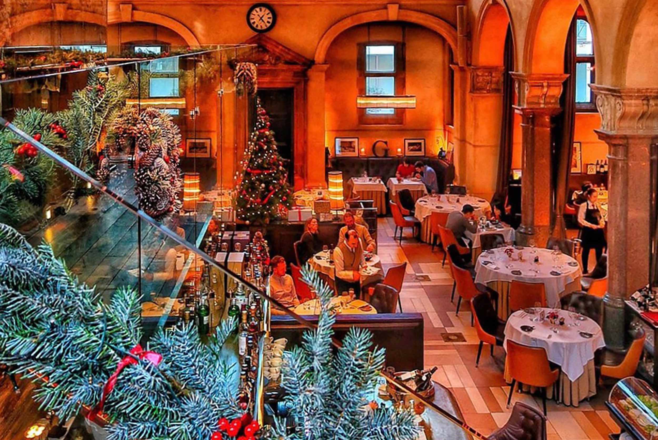 Elegant, festive ambient lighting inside Galvin Restaurants for New Year's Eve dining.
