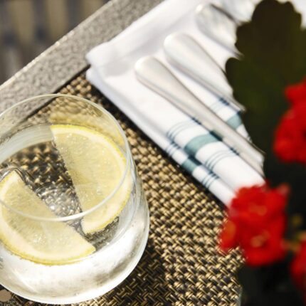 Two sparkling wine glasses beautifully set on a table for a romantic Valentine's Day dinner.