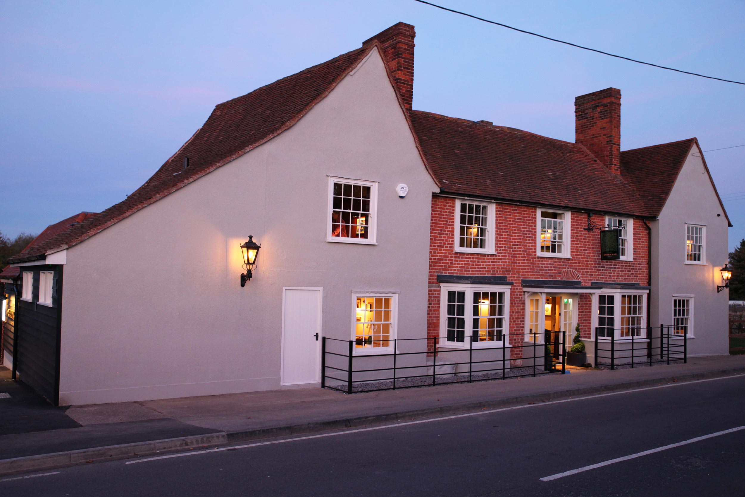 The exterior of the Galvin Green Man at dusk, providing an idyllic countryside setting for a celebratory feast in Chelmsford.