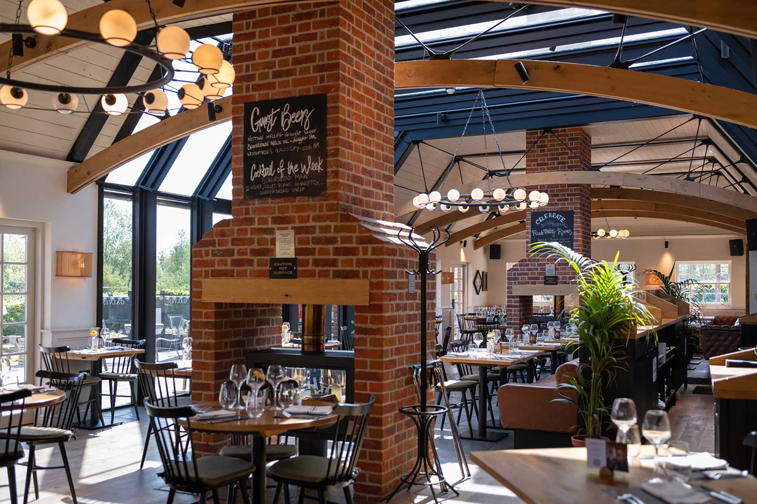 The beautiful, rustic-modern interior dining room at Galvin Green Man in Chelmsford.