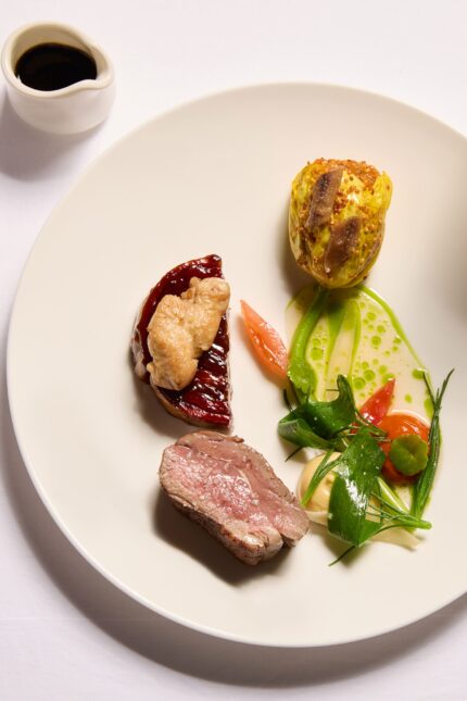 Bright, naturally lit daytime dining room inside the historic Galvin La Chapelle.