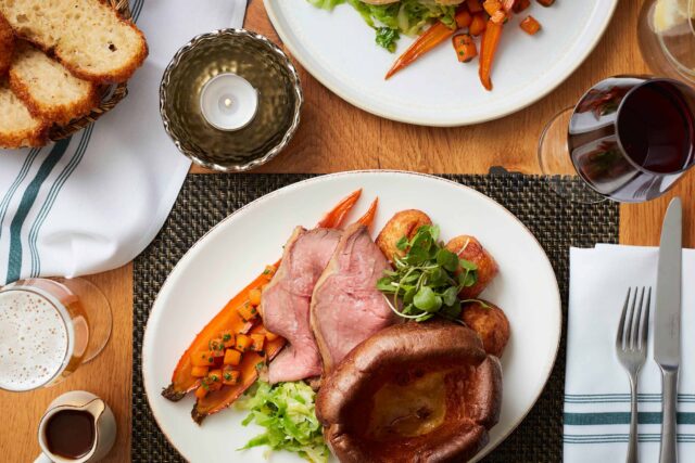 Award-winning Sunday roast beef served with golden Yorkshire puddings at Galvin Green Man.