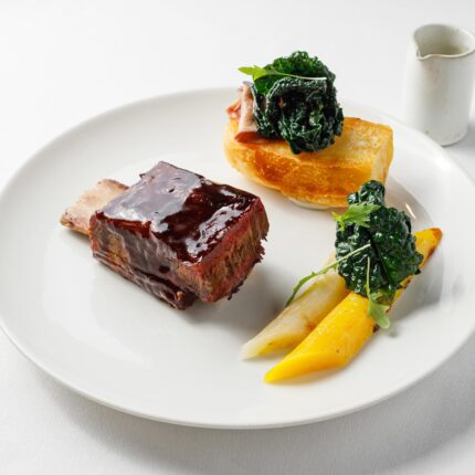 Perfectly crisp roast potatoes and seasonal spring greens served fresh at Galvin's.