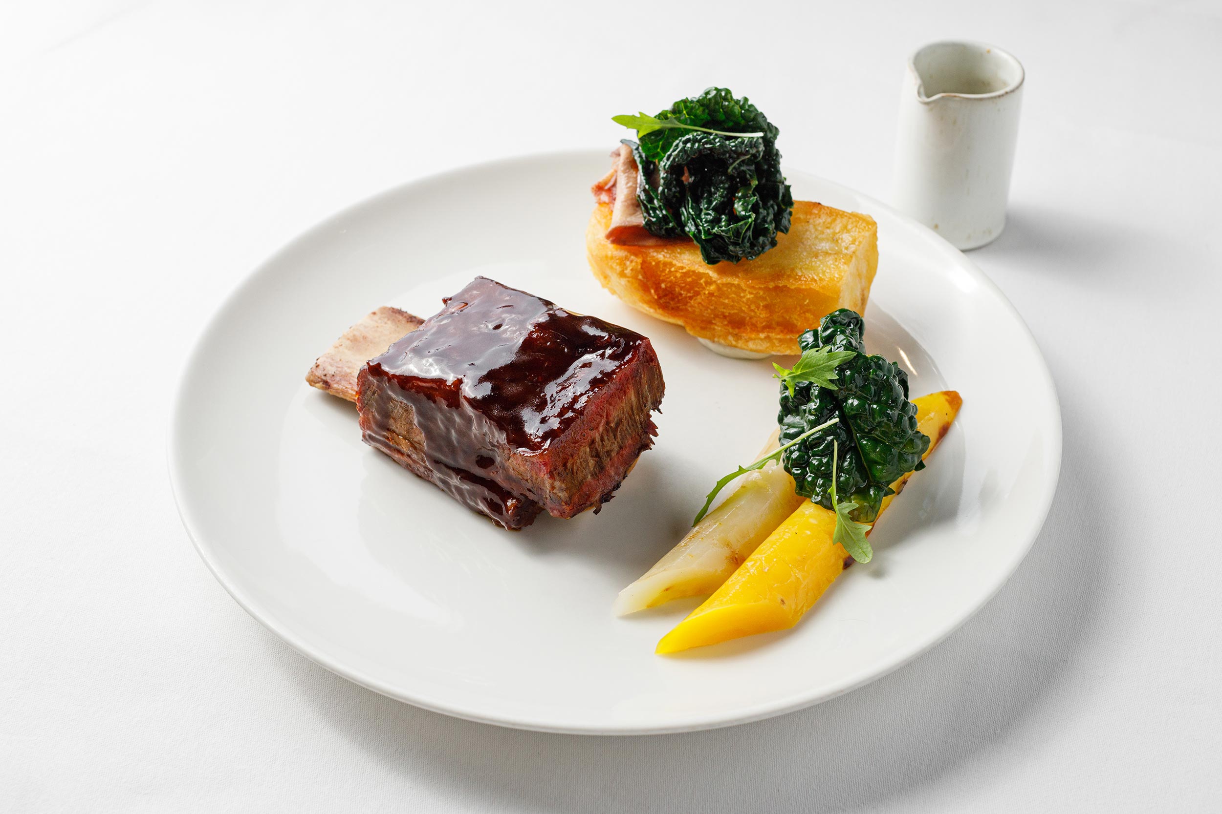 Perfectly crisp roast potatoes and seasonal spring greens served fresh at Galvin's.