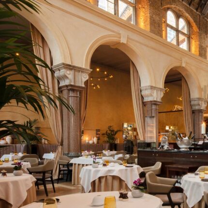 Bespoke private room setup with crisp linens and historic Grade II listed features.