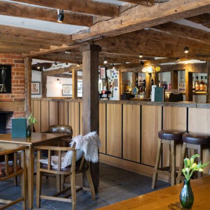 A live acoustic musician performing inside the vibrant dining area at Galvin Green Man.