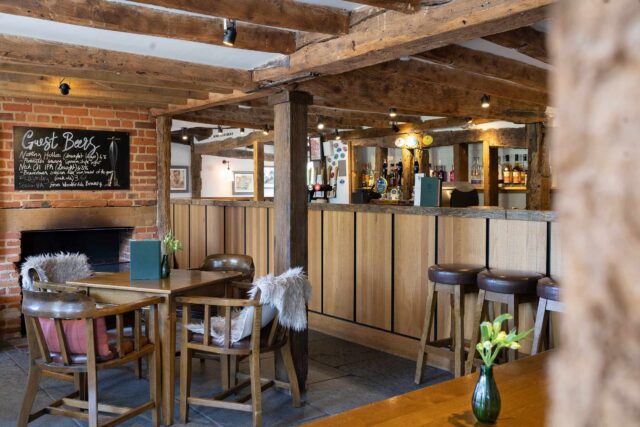 A live acoustic musician performing inside the vibrant dining area at Galvin Green Man.