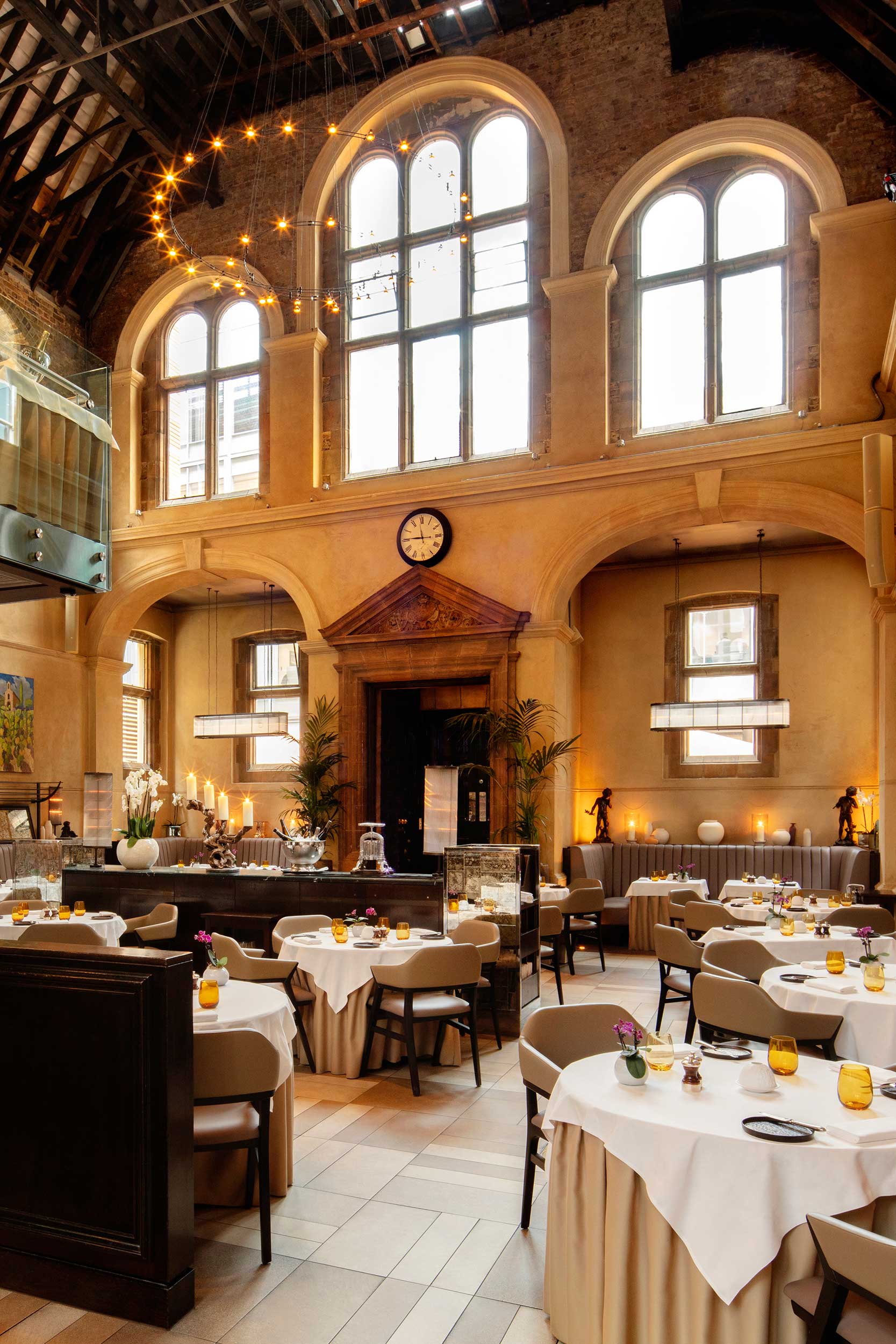 Warm ambient lighting accenting the vaulted ceilings during the seasonal game dinner.