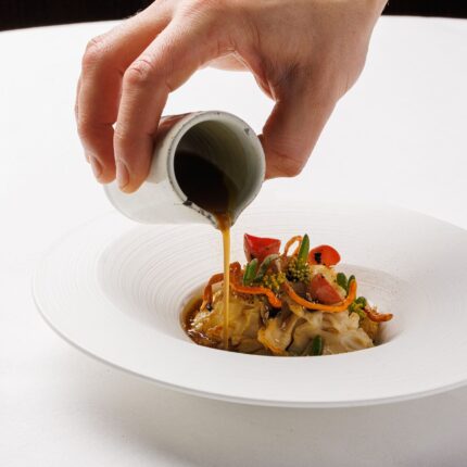 A rich, comforting winter main course being finished with a decadent jus by our expert culinary team.