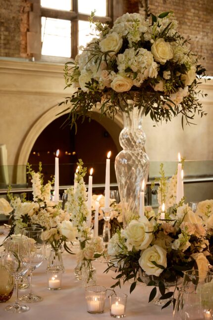 Elegant luxury wedding table styling with white floral arrangements at Galvin La Chapelle.