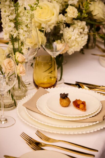 Sleek, contemporary banqueting tables prepared for a wedding breakfast at Galvin London.