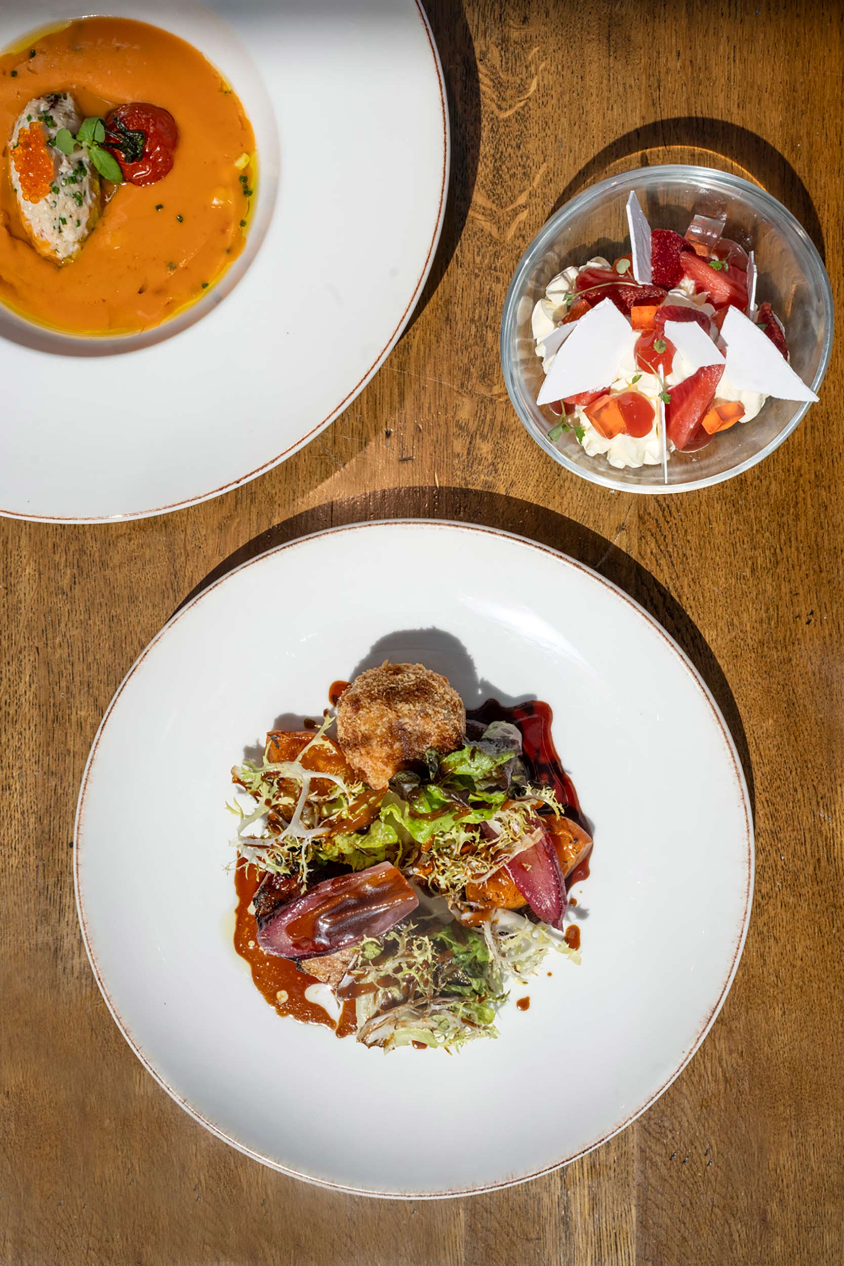 An overhead view of the three-course Taste of Summer seasonal menu at Galvin Essex.