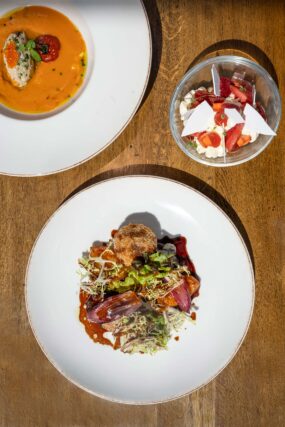An overhead view of the three-course Taste of Summer seasonal menu at Galvin Essex.