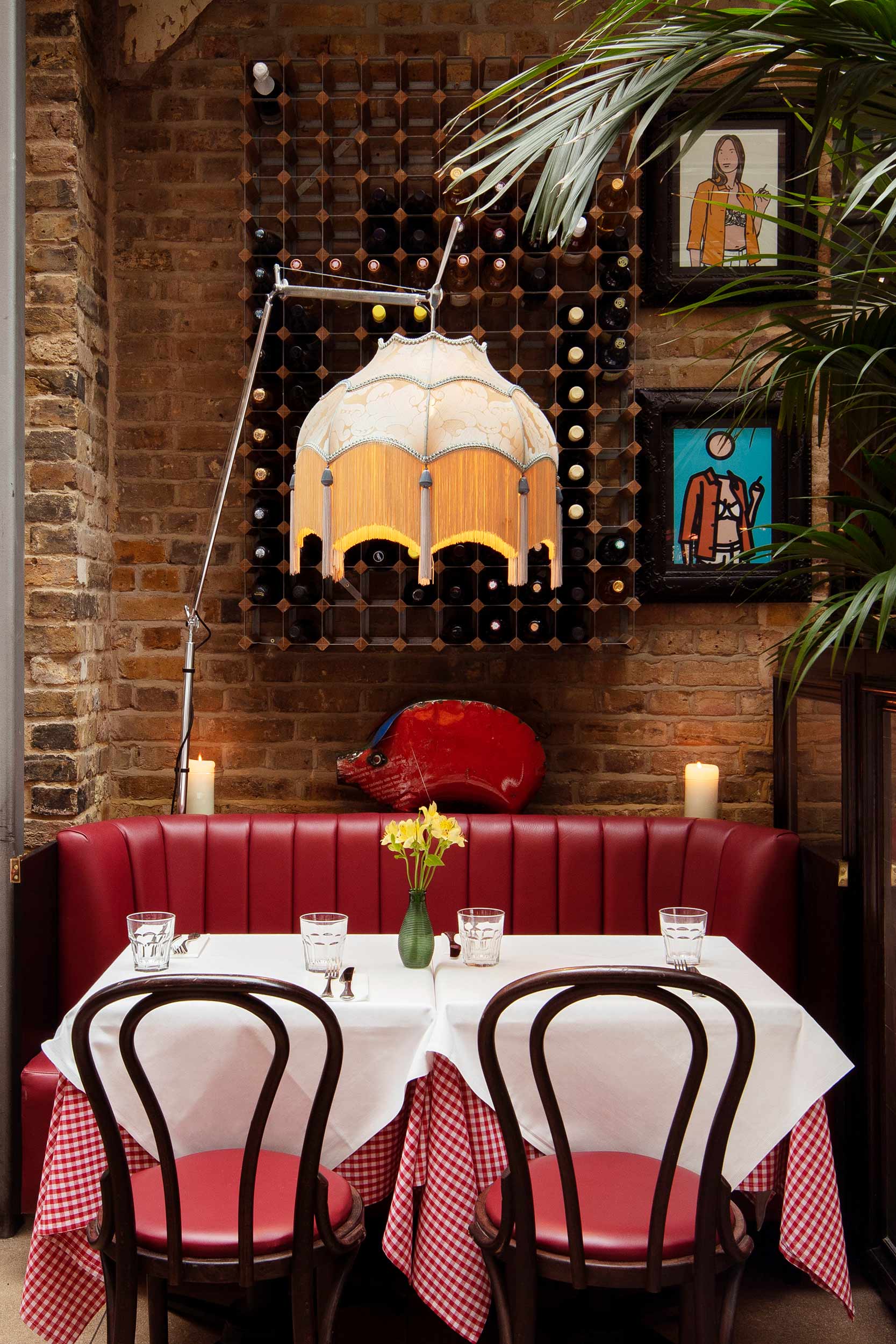 Elegant crystal wine glasses filled with deep ruby Beaujolais wine at Galvin London.