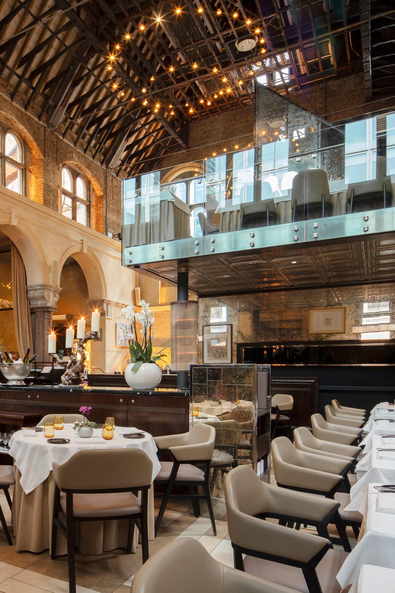 Grand arched hall dining room setup for the annual Grouse Dinner at Galvin La Chapelle.