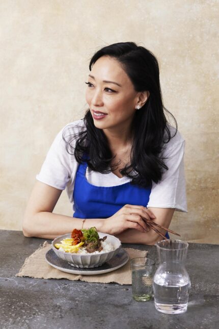 Guest Chef Judy Joo sitting with a Korean dish ahead of her collaborative 4-hand dinner at Galvin Bistrot & Bar in Spitalfields.