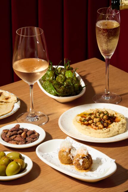A delicious selection of sharing appetizers including croquettes, hummus, and padron peppers from the Autumn Table menu at Galvin Bistrot in Spitalfields.