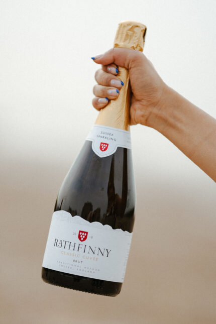 Rathfinny wines at Galvin La Chapelle, hand holding sparkling wine bottle